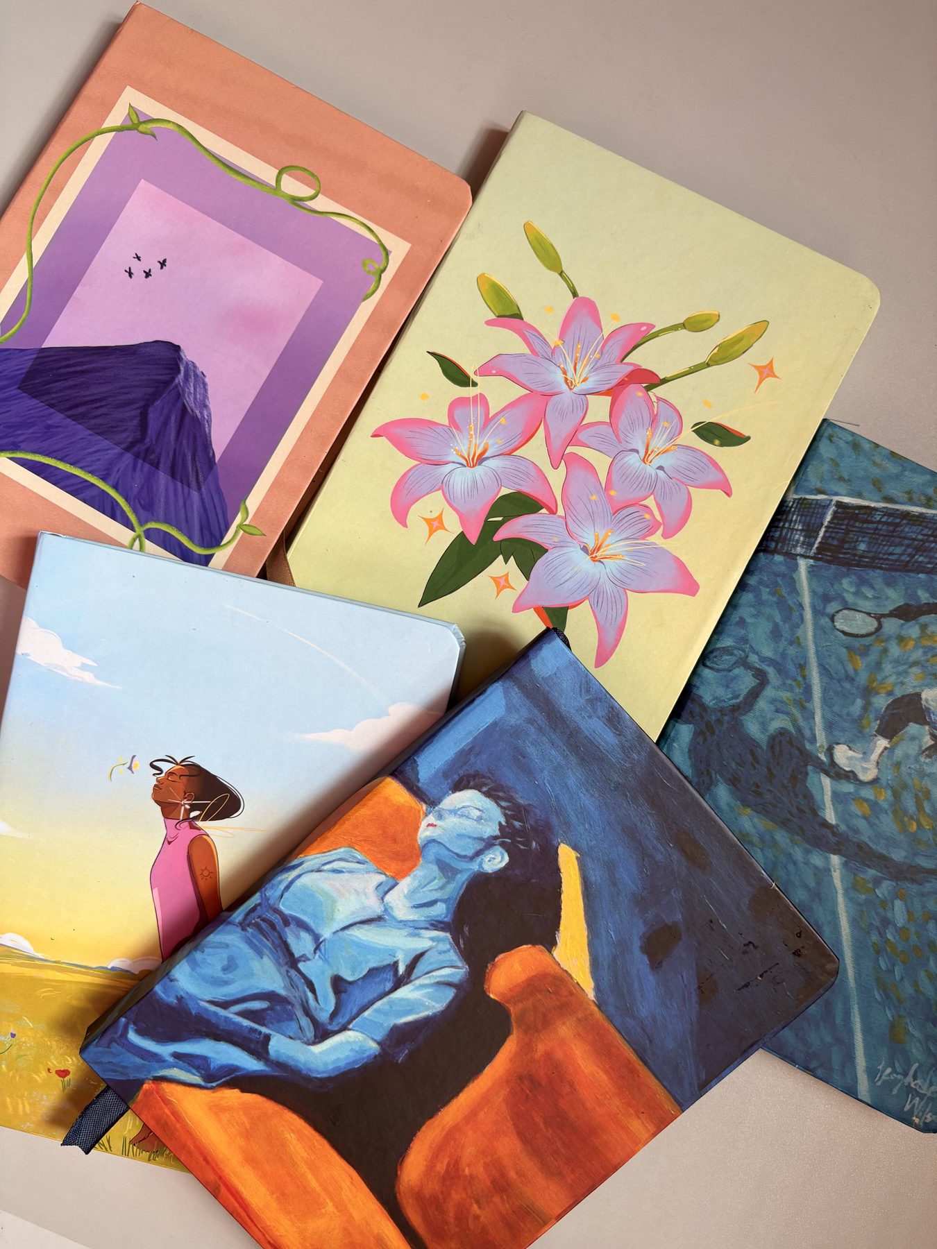 Ayanfe Haven art-covered notebooks flat lay